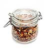 Homemade granola stored in glass jar isolated on white background