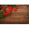 Red mountain ash or rowan berries on rustic wooden background
