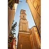 View of the clock tower of Saint Francois in Nice, France, from narrow street in old Nice.