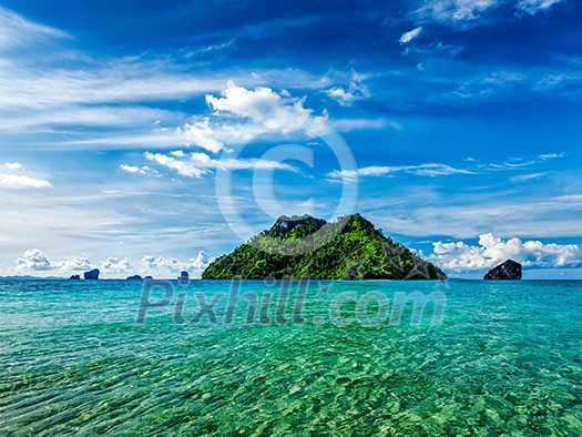 Vacation holidays concept background - tropical island and long-tail boat in sea. Thailand