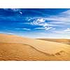 White sand dunes in desert on sunrise, Mui Ne, Vietnam.