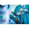 Knee surgery, Orthopedic Operation  - two surgeons performing a knee surgery on a patient (shallow DOF; color toned image)