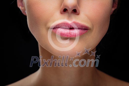 Beauty portrait of a beautiful female model (color toned image) - detail/close-up of the lips