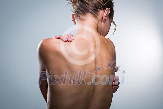 Beauty portrait of a beautiful female model's back (color toned image) - detail/close-up of the lips (color toned image)