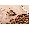 Hazelnuts in bowl on wooden table