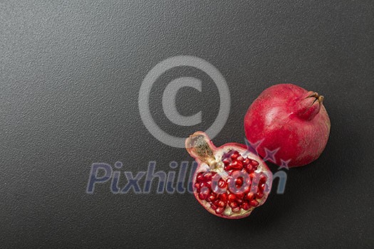 pomegranate on the black background pomegranate on the black background