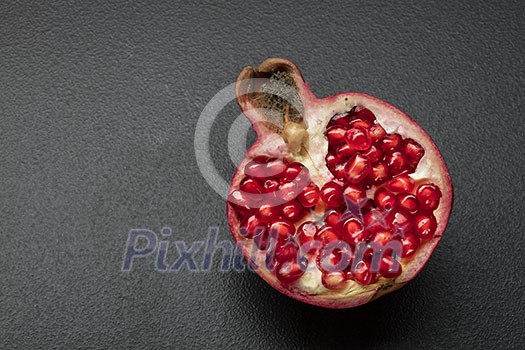 pomegranate on the black background pomegranate on the black background