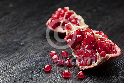 pomegranate on the black background pomegranate on the black background