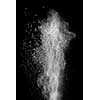 White powder explosion isolated on black background