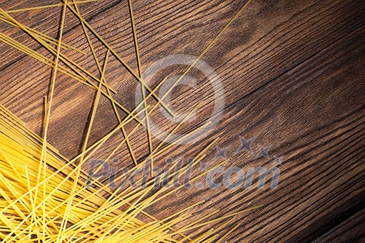italian spaghetti on wooden background. Top view italian spaghetti on wooden background. Top view