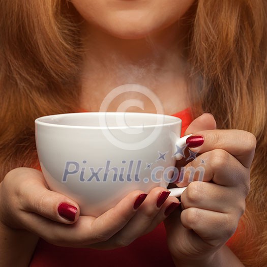 woman holding hot cup woman holding hot cup