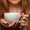 woman holding hot cup