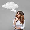 Thinking woman and empty cloud on grey background