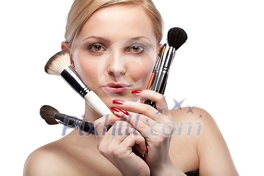 Young smiling woman with make up brushes isolated on white