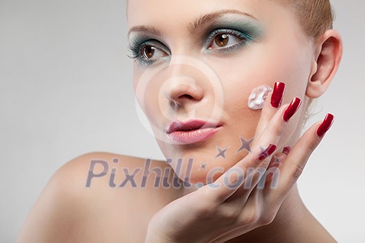 portrait of woman with cream  isolated on white