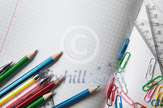 notebook with pencils and clips