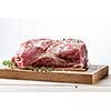 Photo of raw meat. Pork neck with herbs and green thyme on wooden board