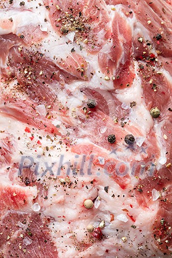 Close up photo of raw meat. Macro of pork neck with herbs and green thyme on wooden board