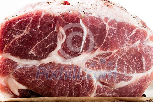 Close up photo of raw meat. Macro of pork neck with herbs and green thyme on wooden board Close up photo of raw meat. Macro of pork neck with herbs and green thyme on wooden board