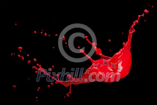 splash of red paint isolated on black background