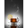 cup of hot tea with lemon and steam
