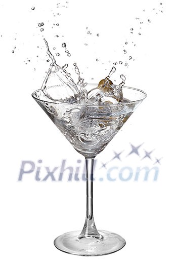 Martini with splash and olive isolated on white