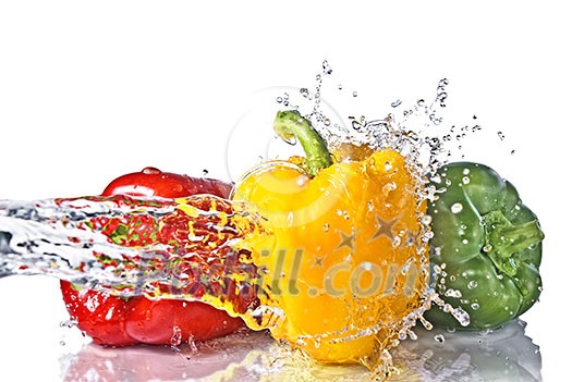 red, yellow and green pepper with water splash isolated on white