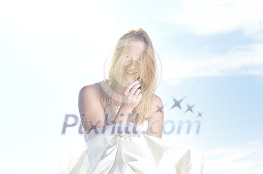 happy young beautiful bride after wedding ceremony event have fun outdoor on meadow at sunset happy young beautiful bride after wedding ceremony event have fun outdoor on meadow at sunset