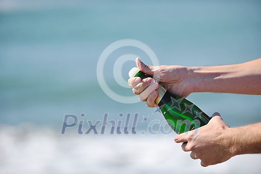 man hands open bottle of champagne alcohol and wine drink outdoor on party celebration event man hands open bottle of champagne alcohol and wine drink outdoor on party celebration event