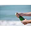 man hands open bottle of champagne alcohol and wine drink outdoor on party celebration event 