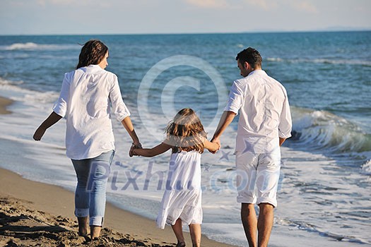 happy young family in white clothing have fun at vacations on beautiful beach happy young family in white clothing have fun at vacations on beautiful beach