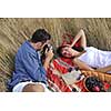 happy young couple relaxing in nature white making photos and taking images and posing for camera