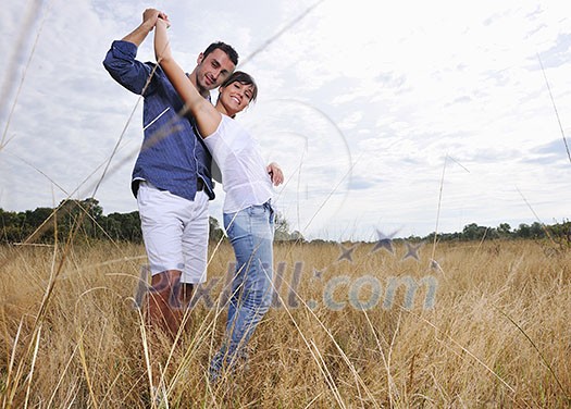 happy young couple have romantic time outdoor while smiling and hug happy young couple have romantic time outdoor while smiling and hug