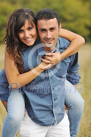 happy young couple have romantic time outdoor while smiling and hug happy young couple have romantic time outdoor while smiling and hug