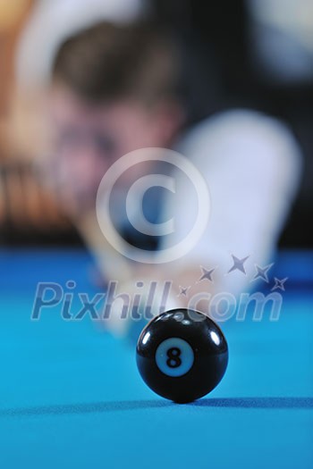 young pro billiard player finding best solution and right angle at billard or snooker pool sport  game 