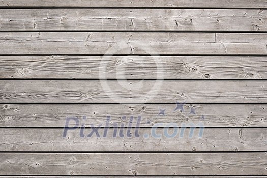 Background of old wooden weathered unpainted deck planks