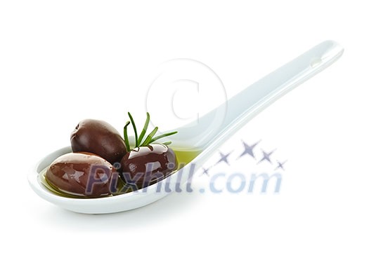 Kalamata olives in olive oil and herbs on spoon