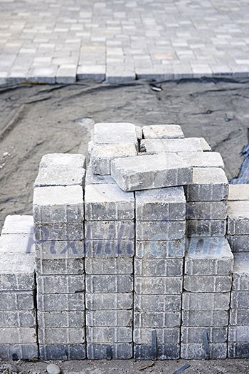 Stacks of interlocking stones for installing driveway landscaping Stacks of interlocking stones for installing driveway landscaping