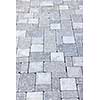 Gray interlocking paving stone driveway from above