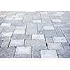 Gray interlocking paving stone driveway from above