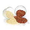 Red and white quinoa grain in glass bowls on white background