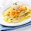 Gourmet squash ravioli dinner served with cheese on plate