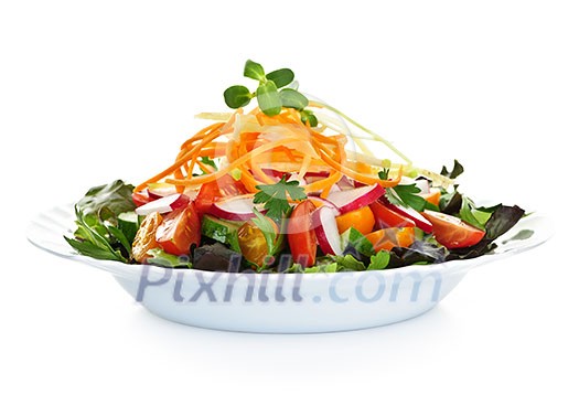 Plate of healthy green garden salad with fresh vegetables on white background