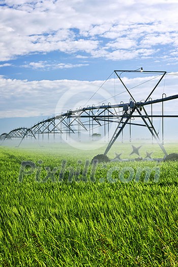 Industrial irrigation equipment on farm field in Saskatchewan, Canada
