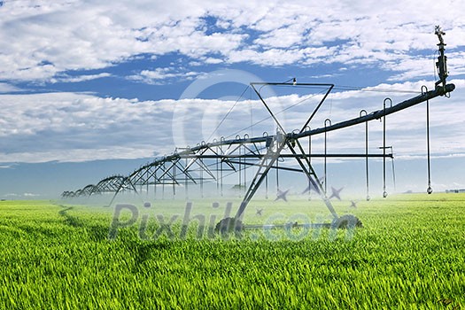 Industrial irrigation equipment on farm field in Saskatchewan, Canada