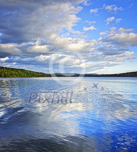 Lake of Two Rivers reflecting blue sky and clouds in Algonquin Park, Canada Lake of Two Rivers reflecting blue sky and clouds in Algonquin Park, Canada