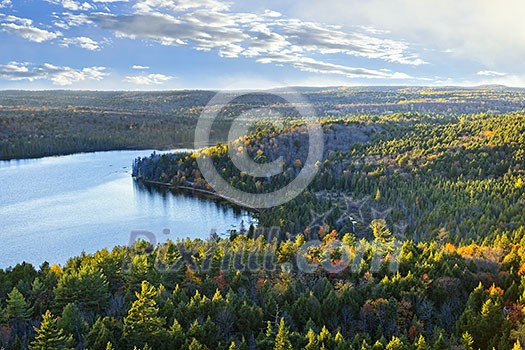 Fall forest and lake with colorful trees from above in Algonquin Park, Canada