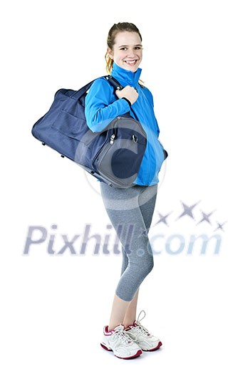 Happy fit young woman with gym bag standing ready for fitness exercise Happy fit young woman with gym bag standing ready for fitness exercise