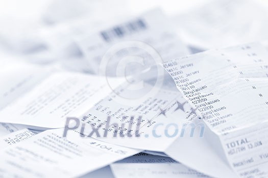 Paper cash register receipts in a lose pile close up Paper cash register receipts in a lose pile close up