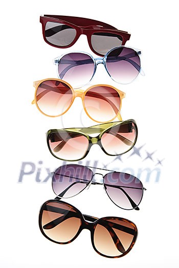 Assorted styles of tinted sunglasses isolated on white background